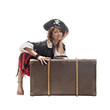 A young woman dressed as a pirate, isolated on white background