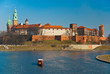 Wawel castle, gondola, Vistula river in Cracow, Poland