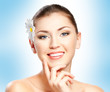Closeup beautiful woman face with flower