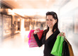 Shopping young woman in the shopping mall.