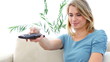 Blonde woman watching TV