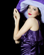 Portrait of the beautiful elegant woman in a lilac hat Portrait of the beautiful elegant woman in a lilac hat