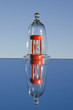 red sandglass in the glass jar and mirror