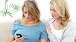 Woman comforts her friend
