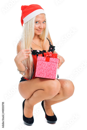 Photo: Sexy young blond woman wearing a corset and a Santa's hat with C Sexy young blond woman wearing a corset and a Santa's hat with C