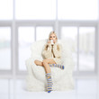 blonde on furry arm-chair