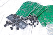 Circuit boards and components with schematics in background