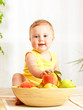 Little baby holding fresh fruits Little baby holding fresh fruits