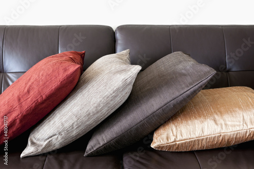 Photo: Cushions on leather sofa Cushions on leather sofa