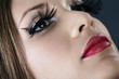 Close-up portrait of young model with red lips