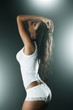 Sexy  woman wearing white tank top and panties from behind