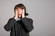 man closed the ears with his hands
