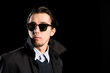 man wearing sunglasses looking away