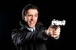 shouting man firing a pistol