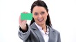 Video: Brunette businesswoman showing a business card Brunette businesswoman showing a business card