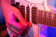young male musician with a white guitar
