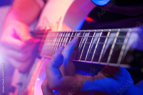 Photo: young male musician with a white guitar young male musician with a white guitar