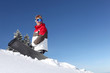 Snowboarder stood at the top of a hill