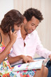 young couple ordering by phone