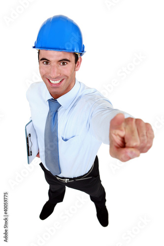 Photo: Enthusiastic engineer pointing upwards Enthusiastic engineer pointing upwards