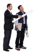 businessman giving explanations to a craftsman