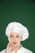 Young female chef  thinking