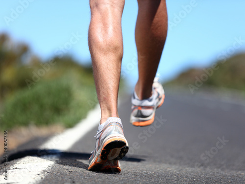 Photo: Running sport shoes on runner Running sport shoes on runner