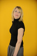 woman posing on yellow background