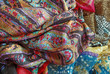 Pile Of Folded Colour Fabrics And Shawls Pile Of Folded Colour Fabrics And Shawls