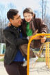 Foto: happy father and little son wearing in jacket play at playground happy father and little son wearing in jacket play at playground
