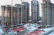 Five high buildings under construction with cranes Five high buildings under construction with cranes