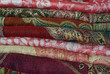 Pile Of Folded Colour Fabrics And Shawls Pile Of Folded Colour Fabrics And Shawls
