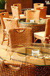 wicker chairs and table in empty comfortable restaurant