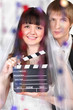Happy beautiful bride and groom look at camera