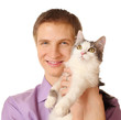 Smiling young man holds cat isolated on white background