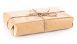 Parcel wrapped in brown paper tied with twine isolated on white Parcel wrapped in brown paper tied with twine isolated on white