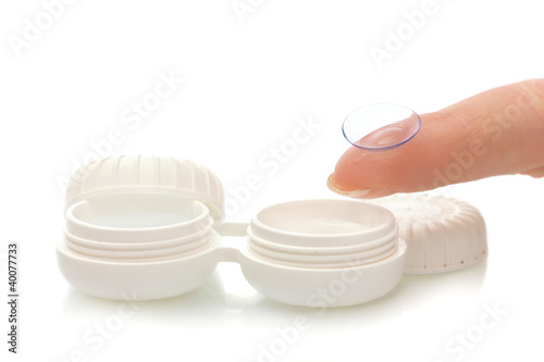 Foto: contact lens on finger and case isolated on white contact lens on finger and case isolated on white