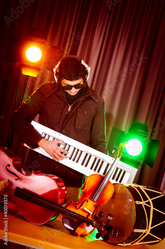 Photo: DJ mixing music at disco DJ mixing music at disco