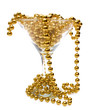 Gold necklace in glass and around it
