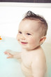 Cute baby sitting in the water