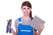 Woman holding tile and tile cutter