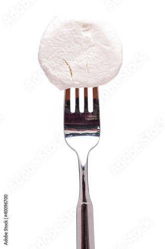Foto: Ziegenkäse auf einer Gabel Ziegenkäse auf einer Gabel