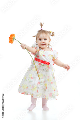 Photo: cute little girl with flower gift, isolated on white cute little girl with flower gift, isolated on white