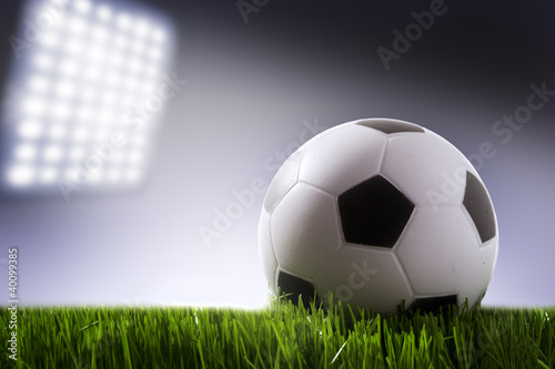 Photo: Soccer ball on the field of stadium Soccer ball on the field of stadium