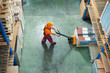 Photo: worker with fork pallet truck worker with fork pallet truck