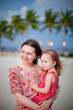 Mother and daughter enjoying sunset