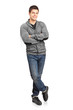 Full length portrait of a happy young man leaning against wall Full length portrait of a happy young man leaning against wall