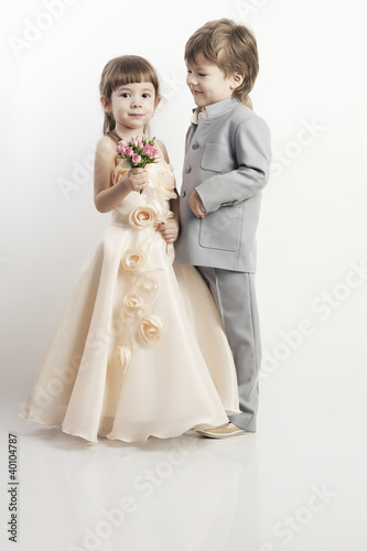 Photo: Two beautiful little boys and girls in wedding dresses Two beautiful little boys and girls in wedding dresses