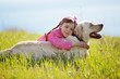 Happy child playing with dog