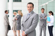 Group of business people stood outside building
